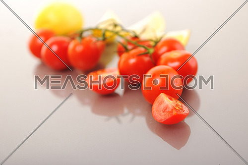 fresh lemon and tomato fruit isolated on white 