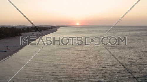 Aerial view of beautiful sea and beach sunrise, seascape and hill mountain on backgrond, Simeri Mare, Calabria, Southern Italy
