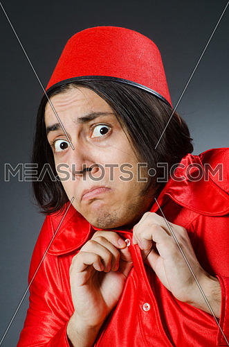 Man wearing red fez hat