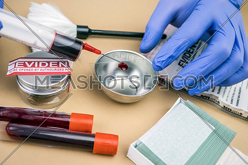 Scientific Police takes blood sample at Laboratorio forensic equipment, conceptual image