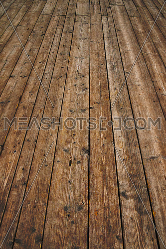 Old vintage rustic aged antique wooden sepia surface with gaps in perspective