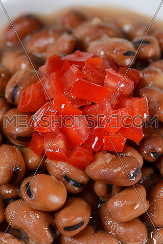 Medames beans, Egyptian oriental dish with tomato diced on top