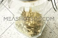 hop pellet in a glass jar
