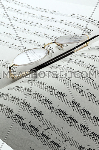 percussion and drums music charts with glasses on top