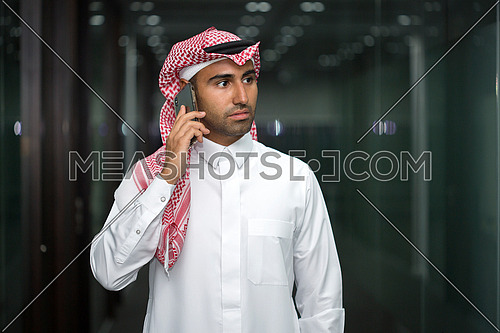 Saudi man talking in his phone