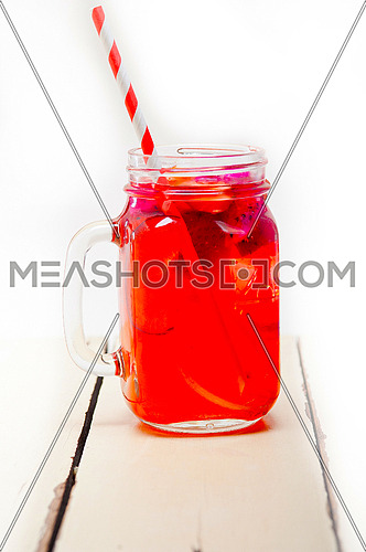 fresh fruit punch refreshing summer  drink over white rustic wood table
