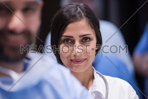 portrait of middle eastern team of doctors in a large modern clinic, two in front of the other