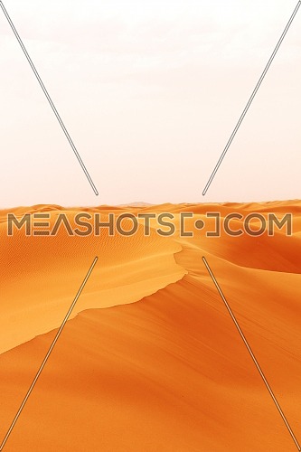 Long shot for Sand dunes in Saudi desert by day.