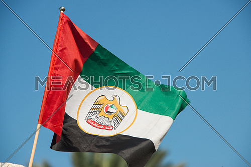 United arab emirates flag against blue sky