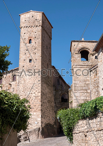Trujillo, Spain - July 14, 2018: Tower of the Alcazar of Luis de Chaves next to the slope of the blood and the Santiago Gate, Trujillo, Caceres Province, Spain