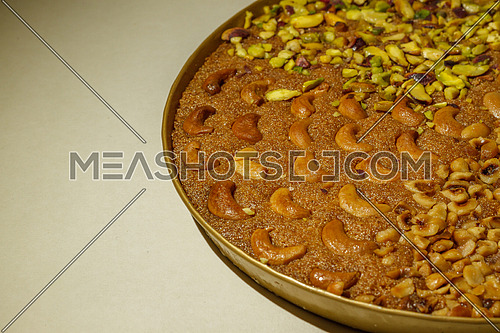 Oriental Ramadan sweets Basbosa with Cashew and nuts