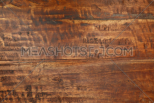 Grunge background texture of brown wood grain with dirty stains, scratches, wholes and cracks