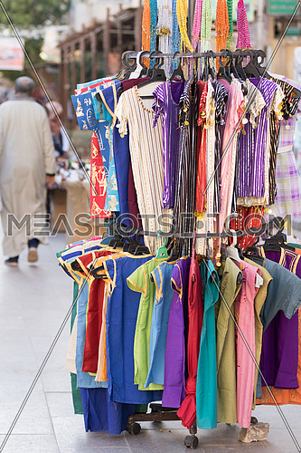 Clothes on a stand in outdoor market