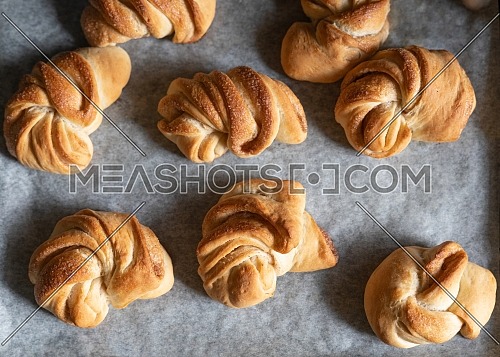desserts, homemade croissants just pulled out of the oven still on parchment paper