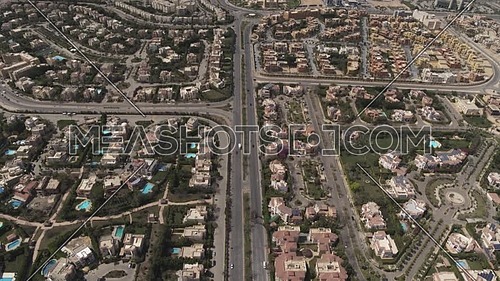 Aerial shot flying over Sheikh Zayed City empty streets during the corona pandemic lockdown by day 10 April