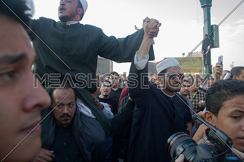 Egyptian muslim sheikhs holding hands during a revolution in egypt
