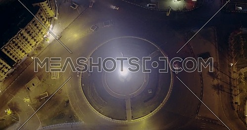 Drone Left of shot for Tahrir Square showing National Flag Pole in Cairo at night