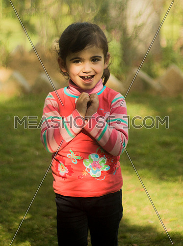 A little Palestineian girl in a garden