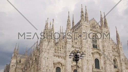 "Nice view of Duomo with the golden statue name ""Madonnina"" on the top of the main spire,overcast sky."