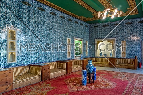 Manial Palace of Prince Mohammed Ali. Blue tiled hall at the residence of the prince's mother with Turkish floral blue pattern ceramic tiles and niches with porcelain vases, Cairo, Egypt