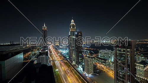 Long shot for Dubai City showing shaikh zayed towers and road at night
