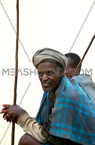 An african man looking towards the camera