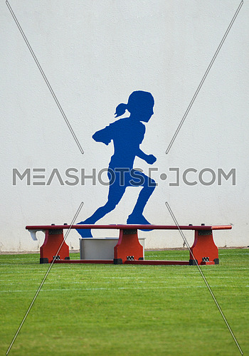 girl drawing running on a wall