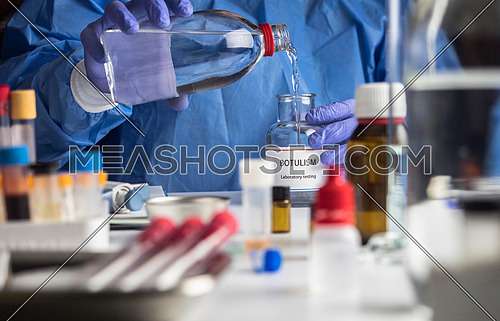 Specialist analyzes botulism Samples in laboratory, conceptual image