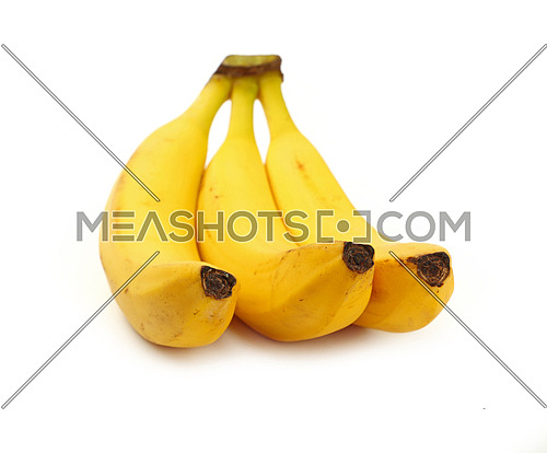Bunch of three fresh yellow bananas isolated on white background, close up, high angle view