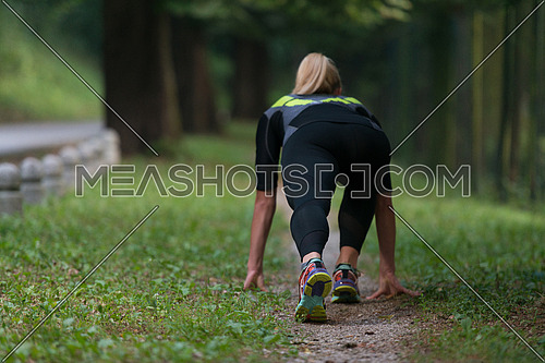 Female Athlete Runner In Starting Line Ready For Running And Sprint - Fitness Healthy Lifestyle Concept