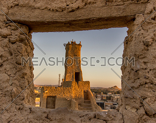 long shot through a window at Shali City The ancient city of Siwa Oasis at day