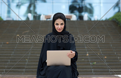 Female employee sitting and working