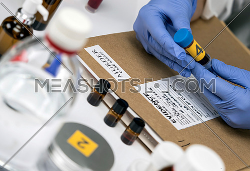 Scientific Police takes blood sample at Laboratory forensic equipment, conceptual image