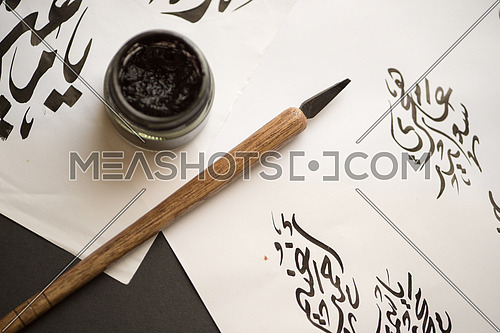Arabic Calligraphy handwriting with ink and wooden pen