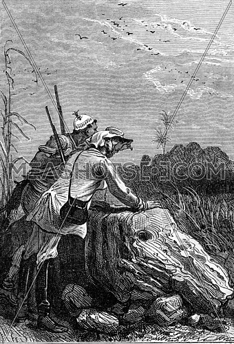 Soldier explorer and Makololo tribe native hunter watching a subject from a distance using a telescope in South Africa. It is as you see it. From Jules Verne 3 Russians and 3 English Book, vintage engraving, 1871.