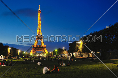 eiffel tower in paris at night tourist and travel icon and attraction