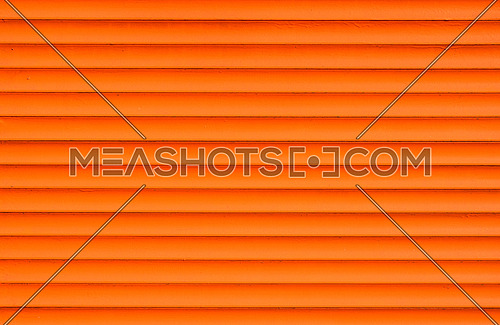 Orange painted horizontal metal window roller shutter blinds background