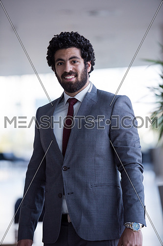 handsome middle eastern business man portrait with laptop bag  at airport terminal