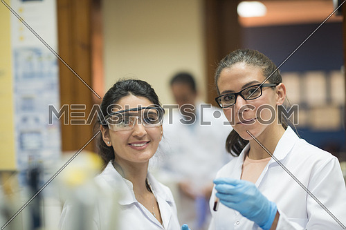 Young middle eastern woman doing a bit of research testing the samples in modern laboratories