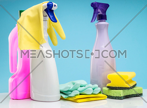 Domestic cleaning utensils insulated on a blue background