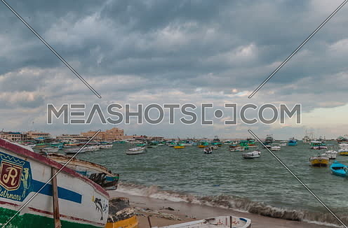 Track Right panorama shot for fishing boats showing Citadel of Qaitbay at Day