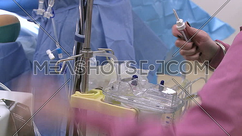 Close shot for Medical containers being prepared for surgery