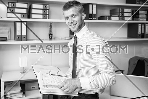 Happy Young Business Man Work In Modern Office On Papers