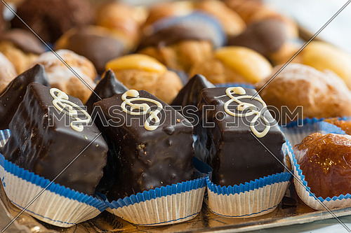 In the pictured colorful pastries with cream and chocolate, the real Italian confectionery.