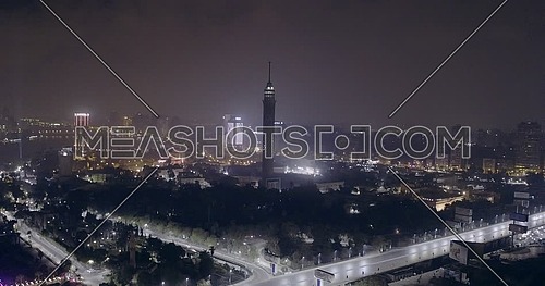 Aerial shot flying towards Cairo Tower at night