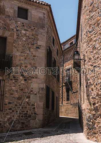 Typical narrow street of the old town of Caceres, Spain
