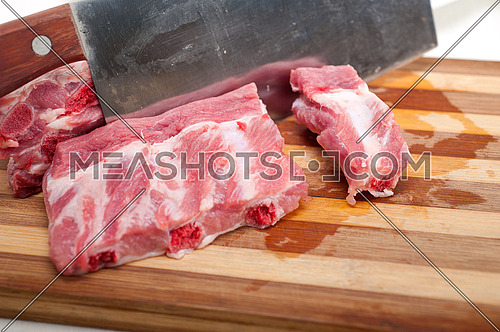 chopping fresh pork ribs ready to cook