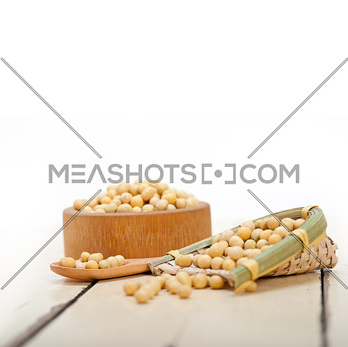 organic soya beans over rustic wood table macro closeup
