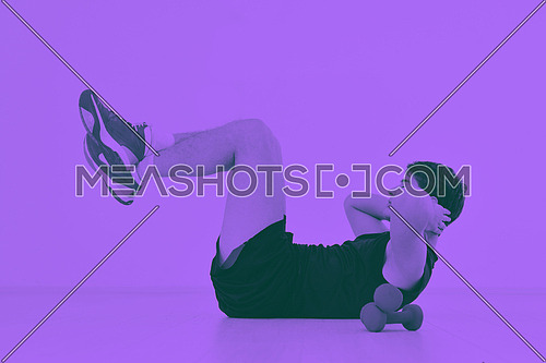young man in fintess sport club exercise withweights and relaxing duo tone