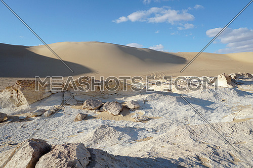 Fossil historical geographic desert  Rocks and bricks with sand dune background  , in Siwa Oasis, Egypt, Historicall , Adventure and Tourism Spot